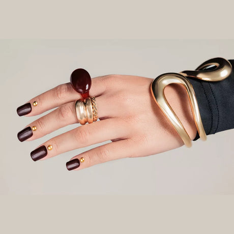 Burnt Walnut 484 deep brown gel polish worn on square-shaped nails