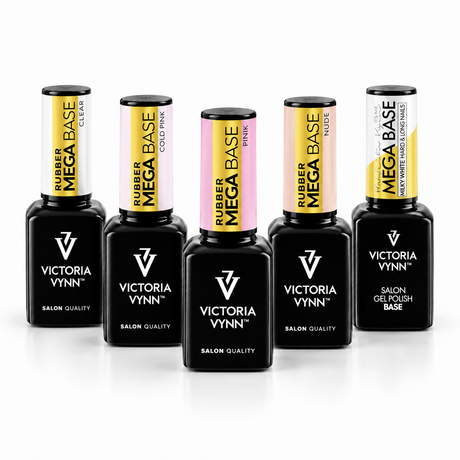 Five Victoria Vynn Rubber Mega Base gel polish bottles arranged in a row on a white background. The bottles are black with colorful labels in yellow, pink, and white, and are labeled with different shade names: Clear, Cold Pink, Pink, Nude, and Milky.