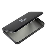 A black metal tin case with a brushed silver interior, shown open on a plain white background. The brand name 'VICTORIA VYNN' is printed in white on the lid.
