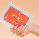 Victoria Vynn Perfect Shape Dual Forms Almond - nail form shown in use during nail extension application