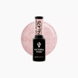 Victoria Vynn Gel Polish 476 in shade peach star martini, featuring a black bottle with a black cap, set against a pink glitter swatch.