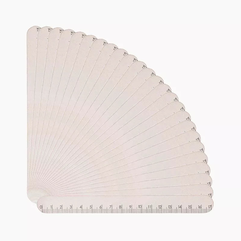 Twenty-five Victoria Vynn Shape Ruler files fanned to show the centimetre ruler edges