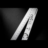 Victoria Vynn Shape Ruler nail file 180/240 beside its centimetre ruler edge on a black background