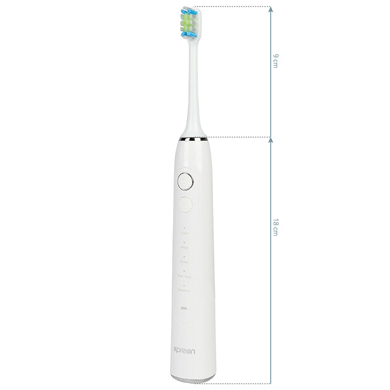 Xpreen Sonic Toothbrush - arranged with the included components on a white background
