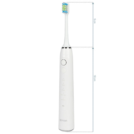 Xpreen Sonic Toothbrush - arranged with the included components on a white background