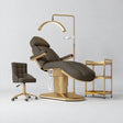 Manufakturo Étoile Cocoa Mocha complete studio set with electric beauty bed, Noblesse chair, gold trolley and V3 Pro Gold treatment lamp with an aligned stand on the original grey studio background.