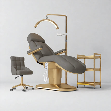 Manufakturo Étoile Deep Ash complete studio set with electric beauty bed, Noblesse chair, gold trolley and V3 Pro Gold treatment lamp with an aligned stand on the original grey studio background.