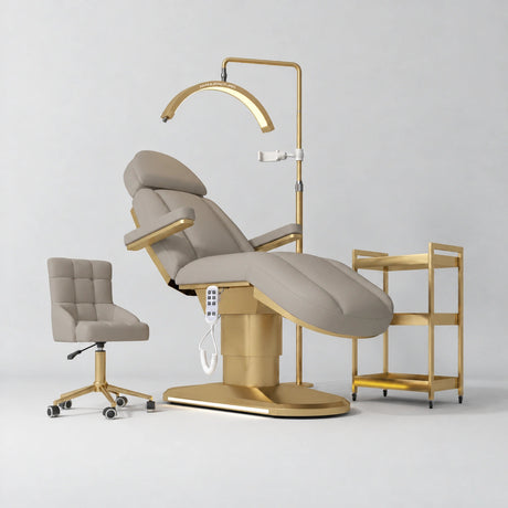 Manufakturo Étoile Stone Taupe complete studio set with electric beauty bed, Noblesse chair, gold trolley and V3 Pro Gold treatment lamp with an aligned stand on the original grey studio background.