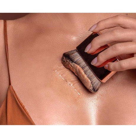 Body Boom Shimmer Gold Body Highlighter - finished result shown on a model's face
