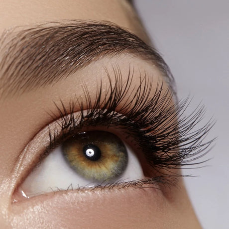 Eveline Total Action Concentrated Eyelash Serum 8in1 - product displayed with its packaging on a dark background