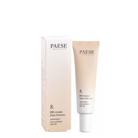 Paese DD Cream Daily Defense SPF30 - foundation tube displayed over matching shade swatches