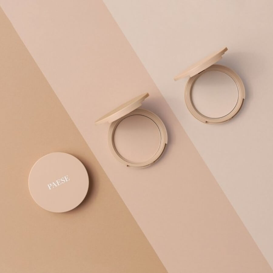 Paese Glowing Powder Illuminating Pressed Powder - shade swatches shown beside the product