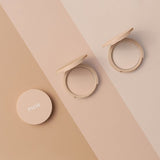 Paese Glowing Powder Illuminating Pressed Powder - shade swatches shown beside the product