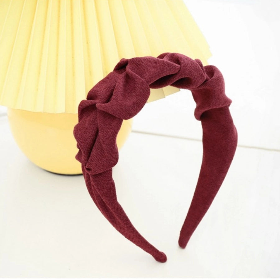 Roxie Cosmetics Burgundy Crinkle Headband - displayed in a styled studio photograph