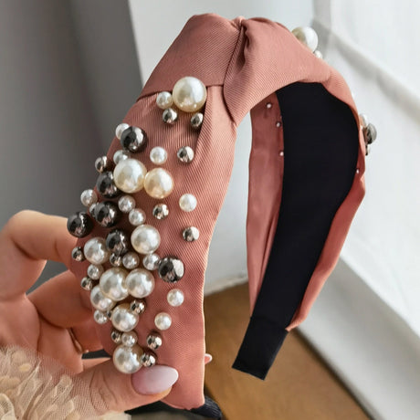 Roxie Cosmetics Classic Headband Pink With Pearls - product displayed with its packaging on a dark background