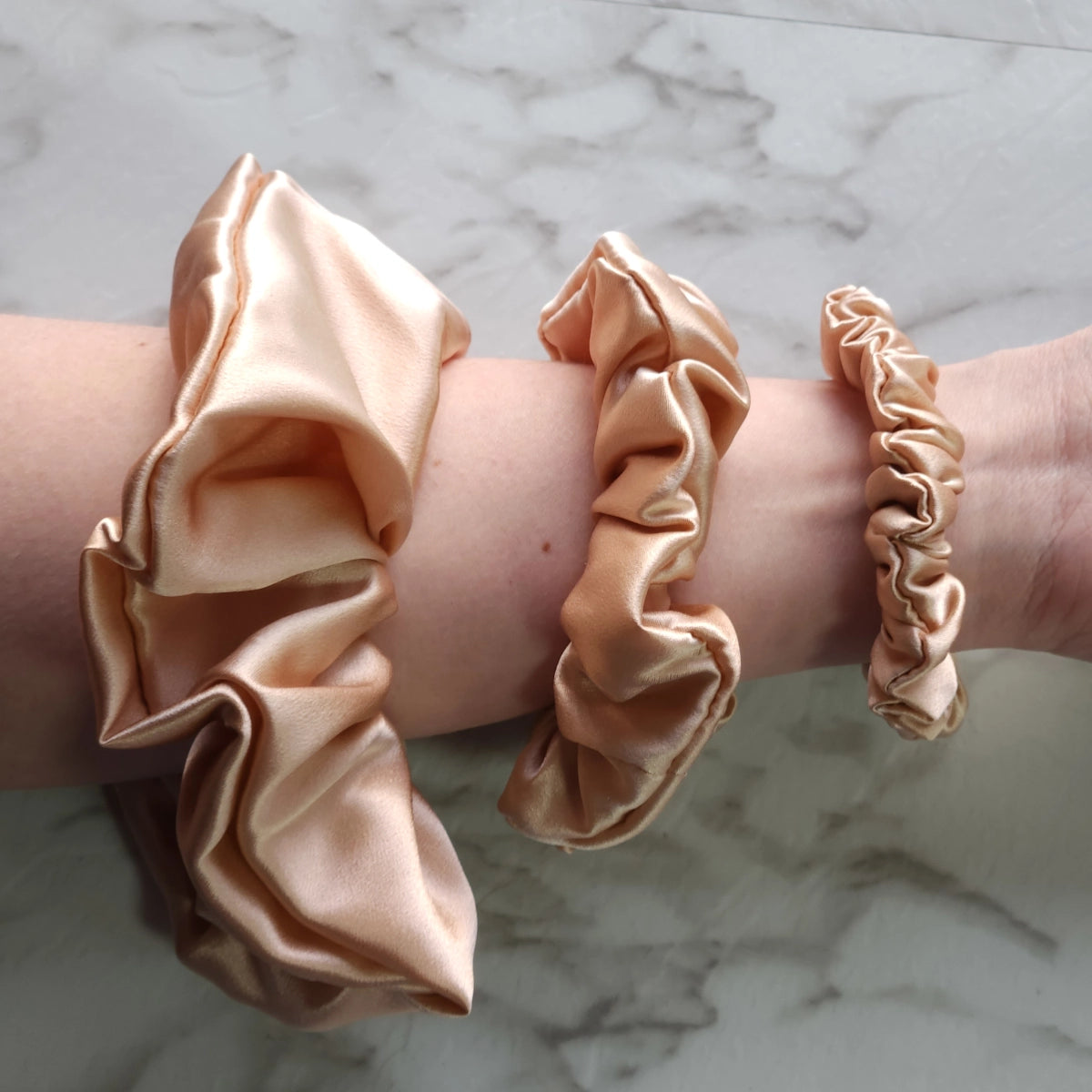 Roxie Cosmetics Luxe 100% Mulberry Silk 30 Momme Scrunchie Beige - shade swatches shown beside the product