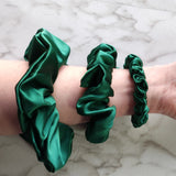 Roxie Cosmetics Luxe 100% Mulberry Silk 30 Momme Scrunchie Bottle Green - shade swatches shown beside the product
