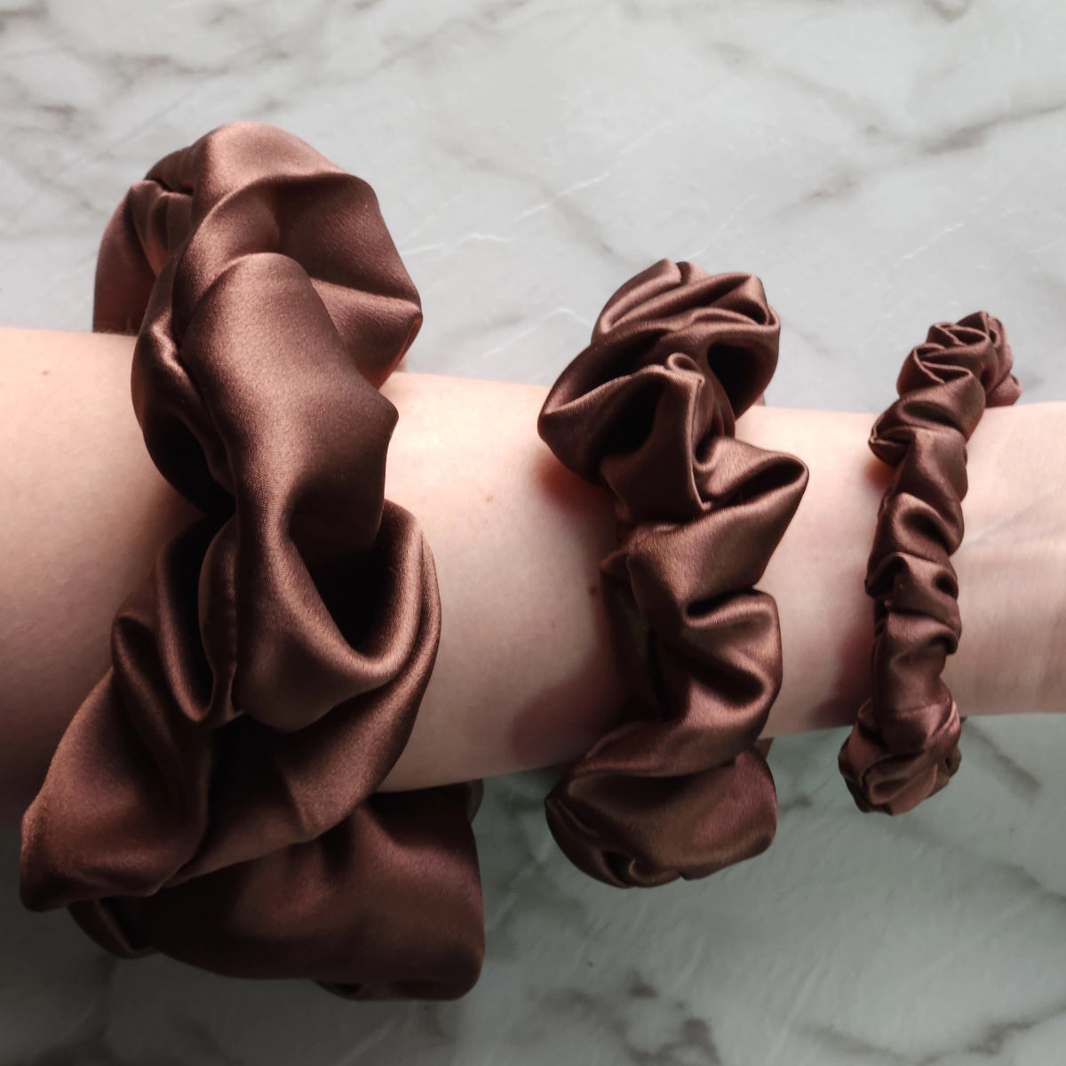 Roxie Cosmetics Luxe 100% Mulberry Silk 30 Momme Scrunchie Chocolate Brown - shade swatches shown beside the product