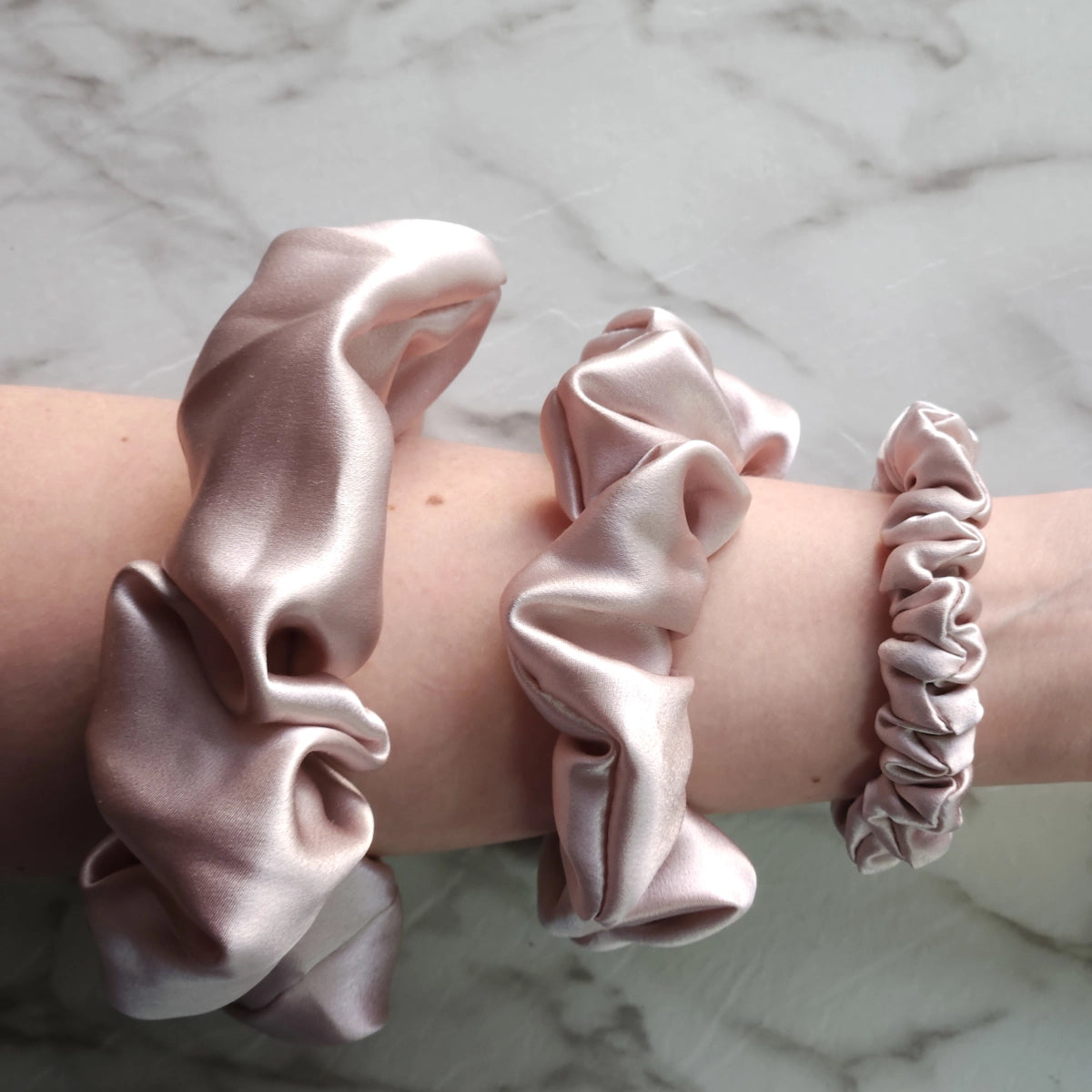 Roxie Cosmetics Luxe 100% Mulberry Silk 30 Momme Scrunchie Powder Pink - shade swatches shown beside the product