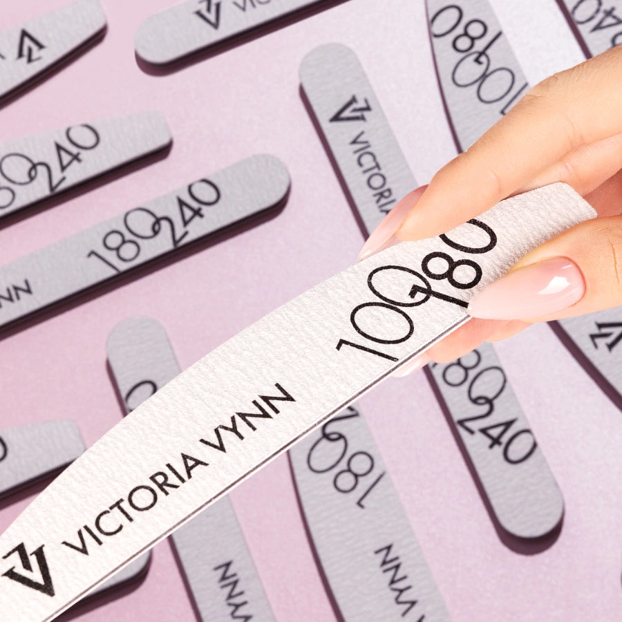 Victoria Vynn Crescent Grey Nail Files 100/180 10pcs - shown held in the hand
